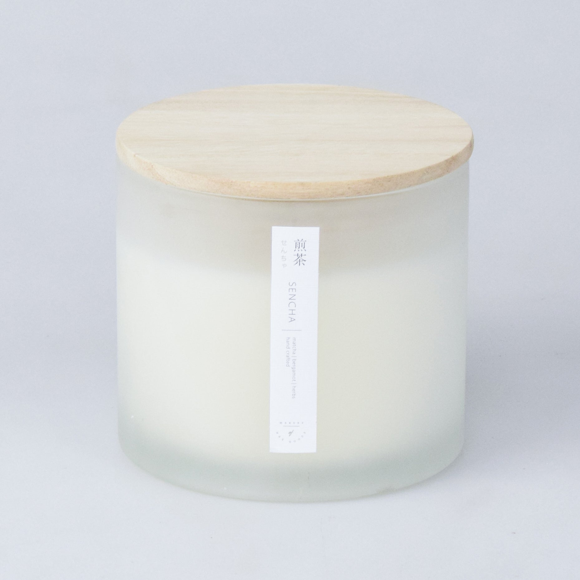 matte white glass candle container with wooden lid